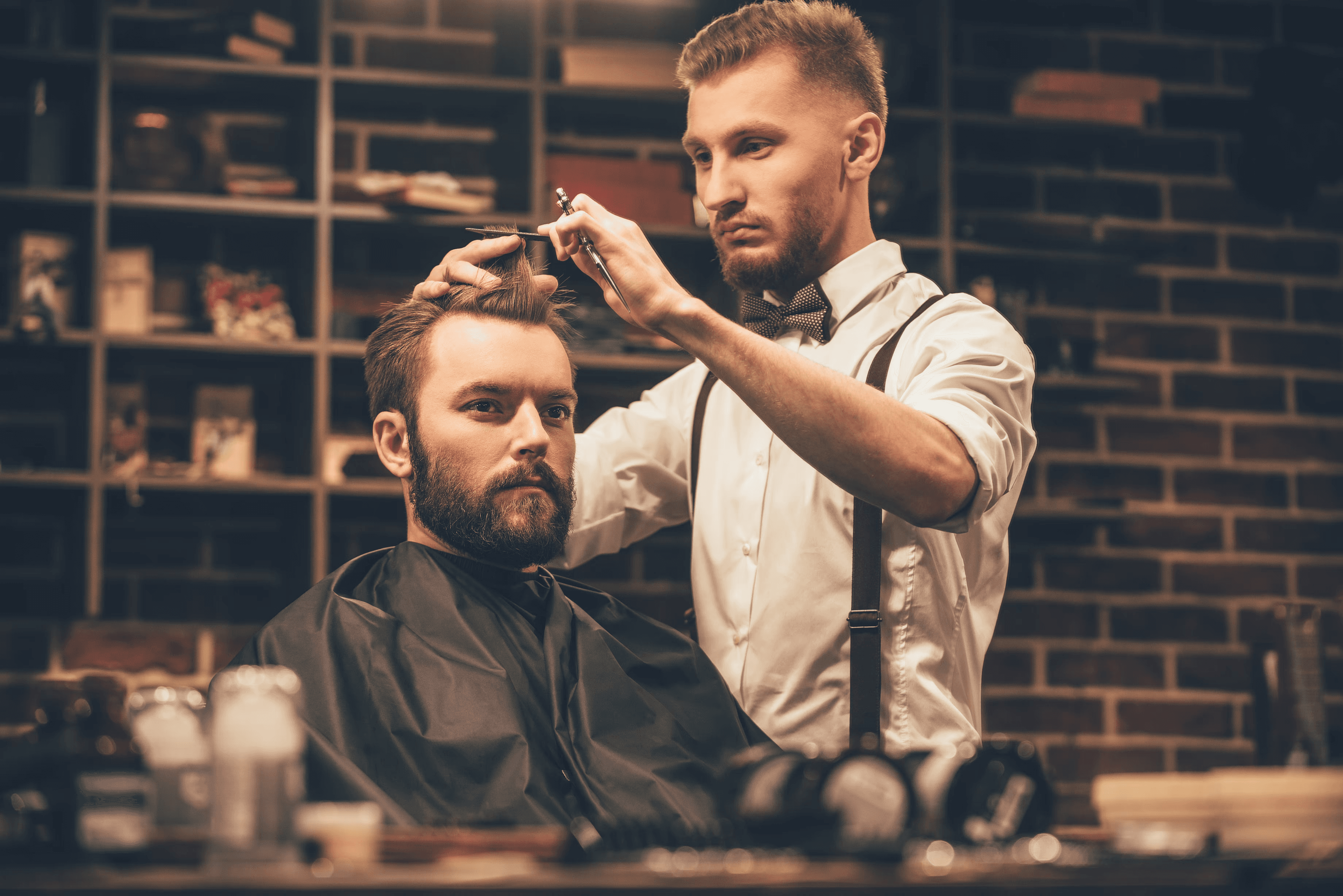 Beauty professional with client